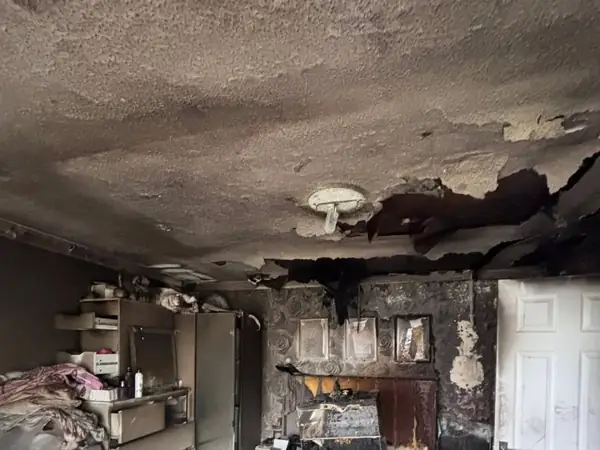 Fire-damaged asbestos ceiling being cleared in Waterlooville