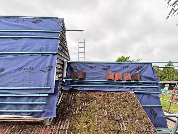 Moss-covered corrugated asbestos roof removal in Basingstoke