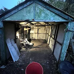 Interior of an asbestos-constructed garage being stripped out