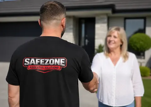 Two members of SafeZone Asbestos Solutions' on-site team shaking hands with a customer